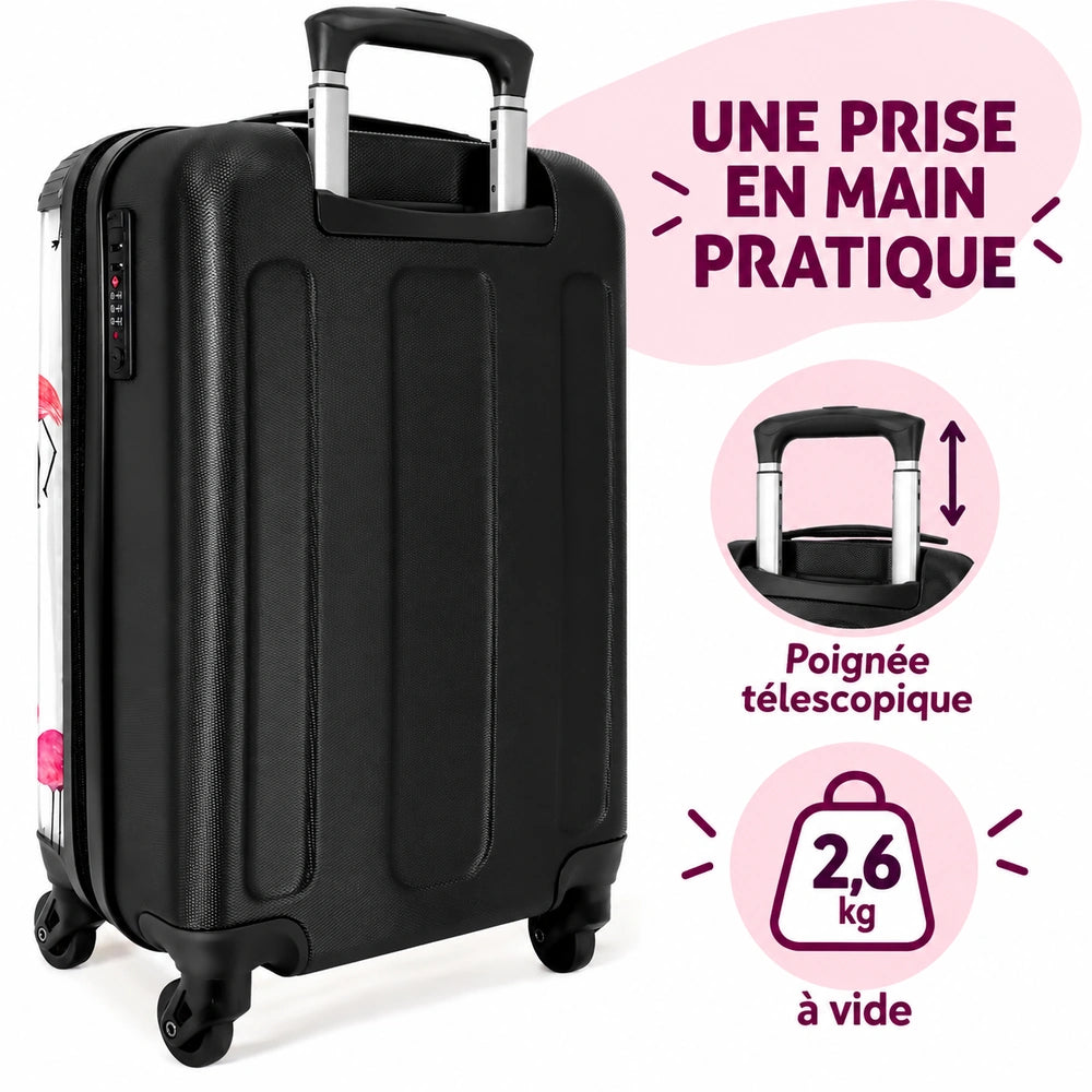 Valise flamant rose prise en main